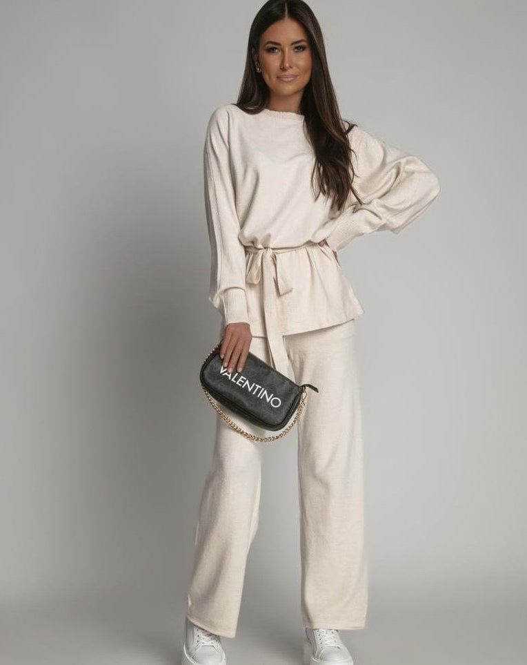 Kremowy komplet swetrowy z wiązaniem i szerokimi spodniami damski 
